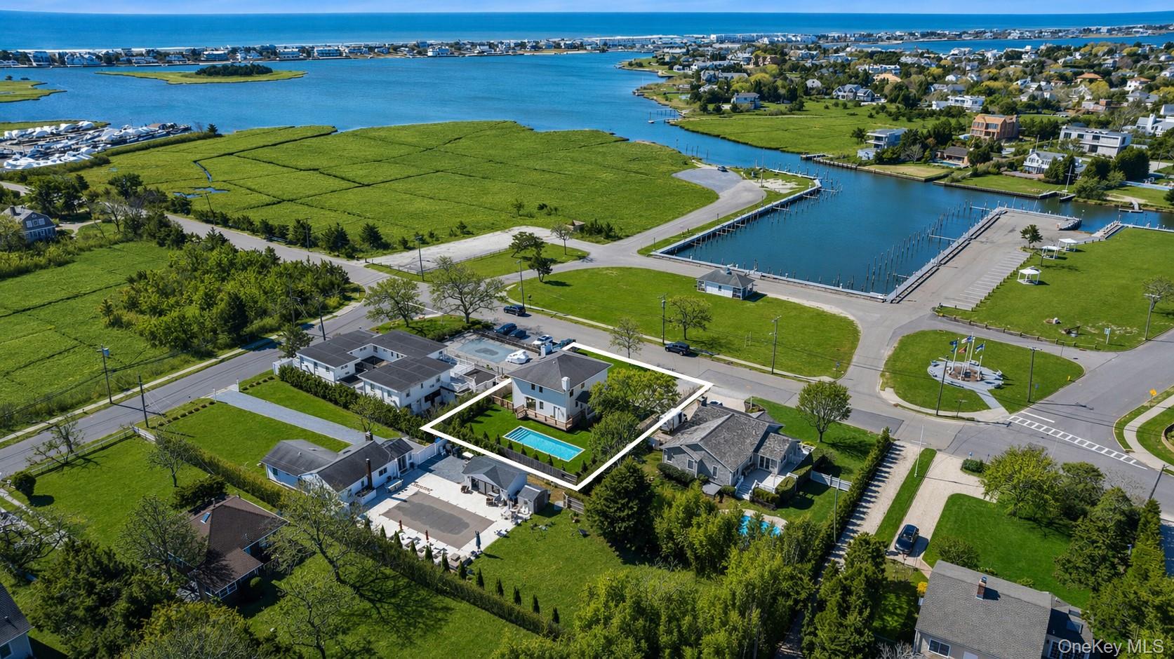54 Library Avenue Westhampton Beach, NY 11978 - Photo 1 of 21 an aerial view of a house with a ocean view