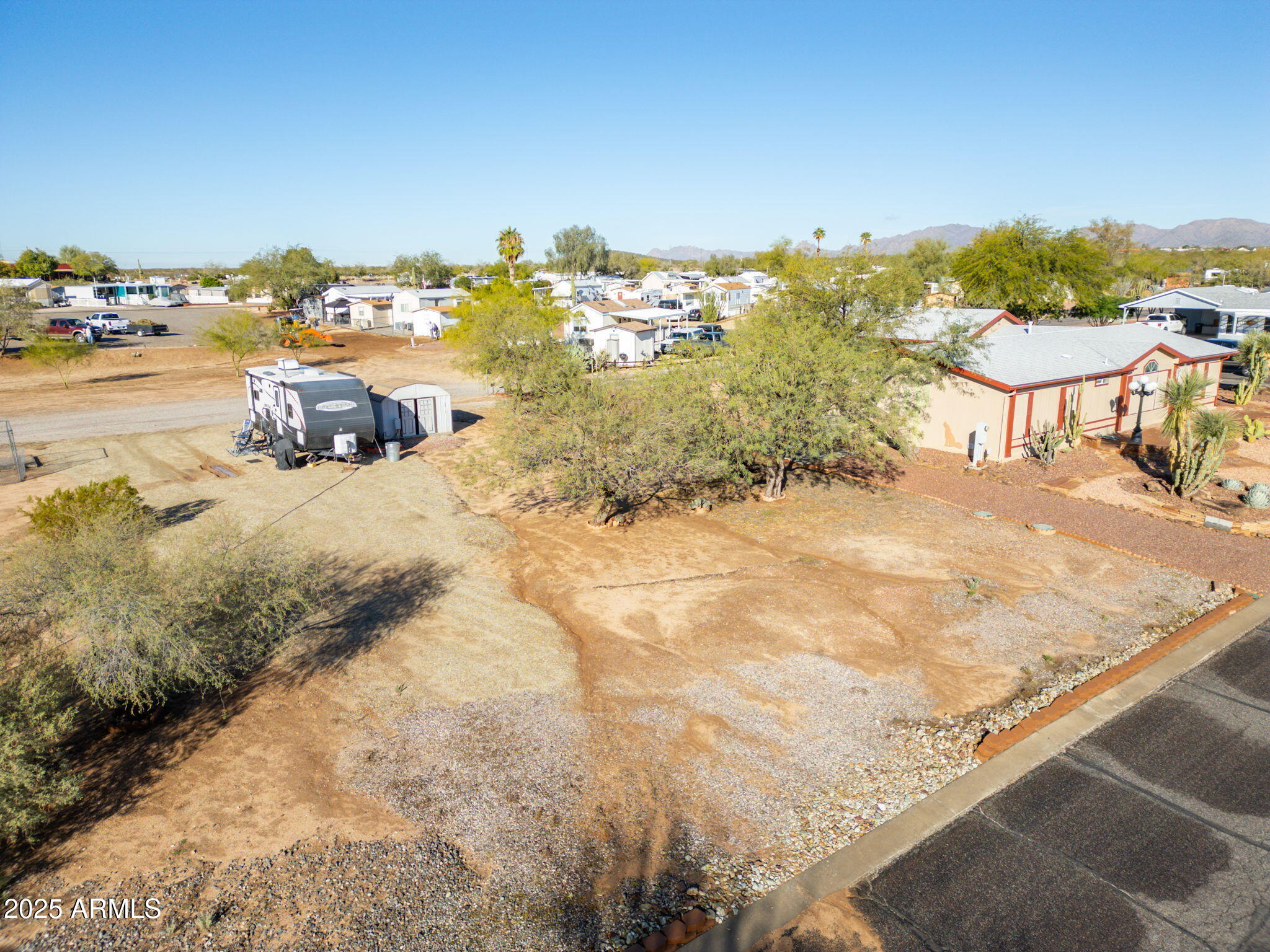 30654 Sun Rider Way, Unit 101 Congress, AZ 85332 - Photo 14 of 28 a view of a terrace with lawn chairs