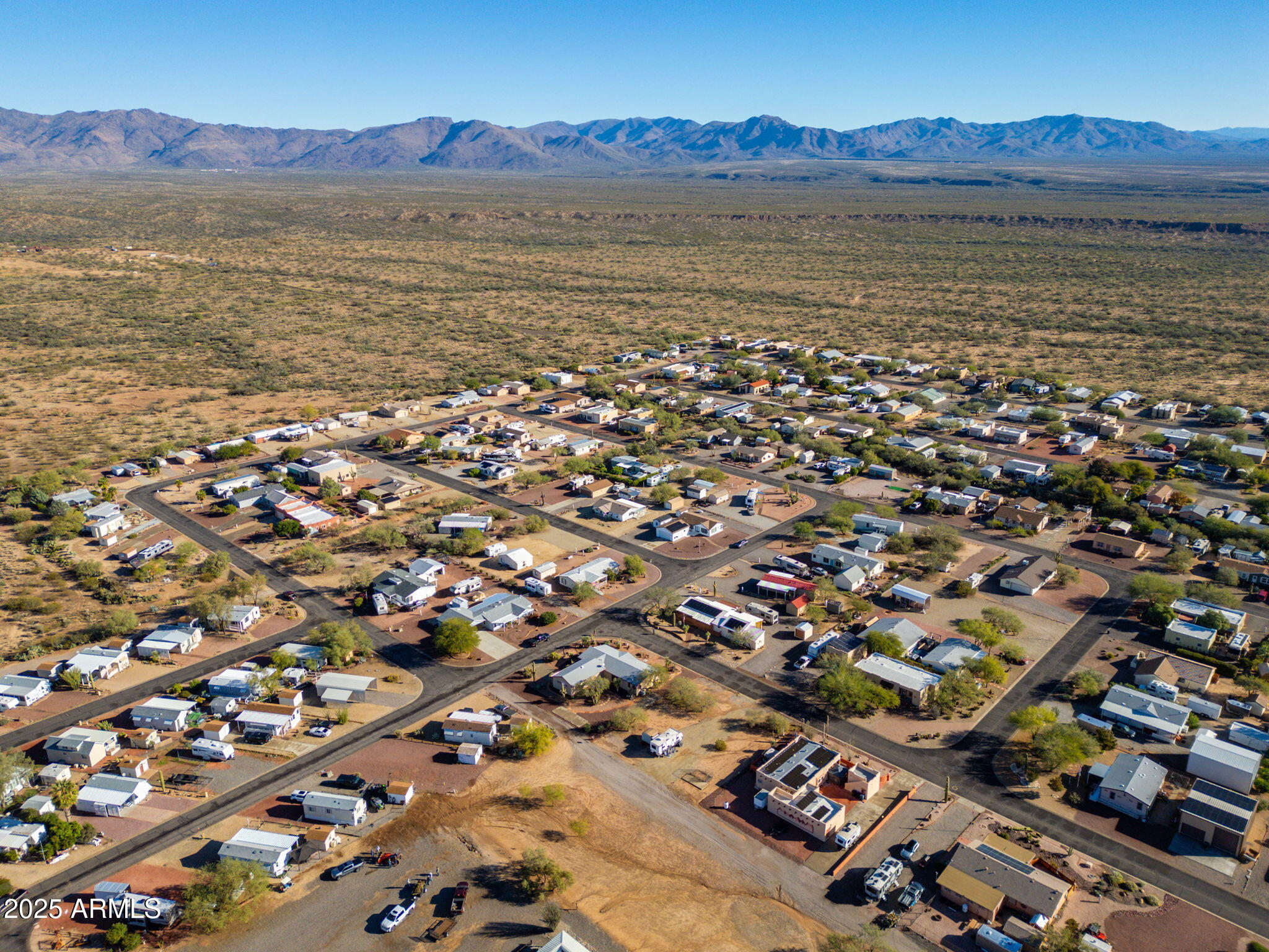 30654 Sun Rider Way, Unit 101 Congress, AZ 85332 - Photo 25 of 28 an aerial view of residential building with outdoor space
