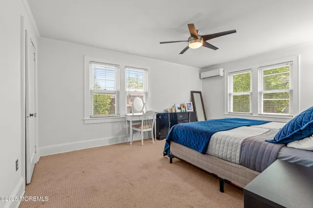 a bed room with a bed and a window