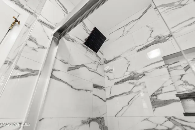 a white building with a granite floor