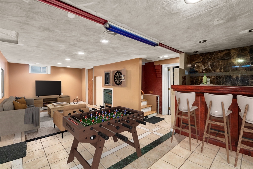 14 Channing Street Worcester, MA 01605 - Photo 12 of 16 a living room with furniture and a flat screen tv