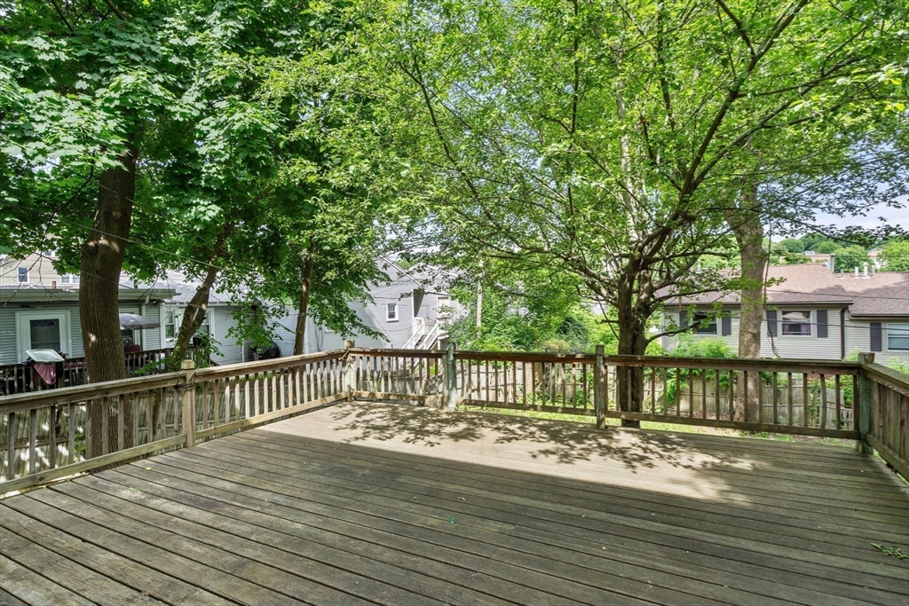 14 Channing Street Worcester, MA 01605 - Photo 15 of 16 a view of a wooden deck with a bench