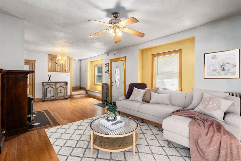 14 Channing Street Worcester, MA 01605 - Photo 2 of 16 a living room with furniture and a fireplace