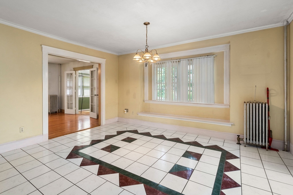 14 Channing Street Worcester, MA 01605 - Photo 8 of 16 a bedroom with a bed and a window