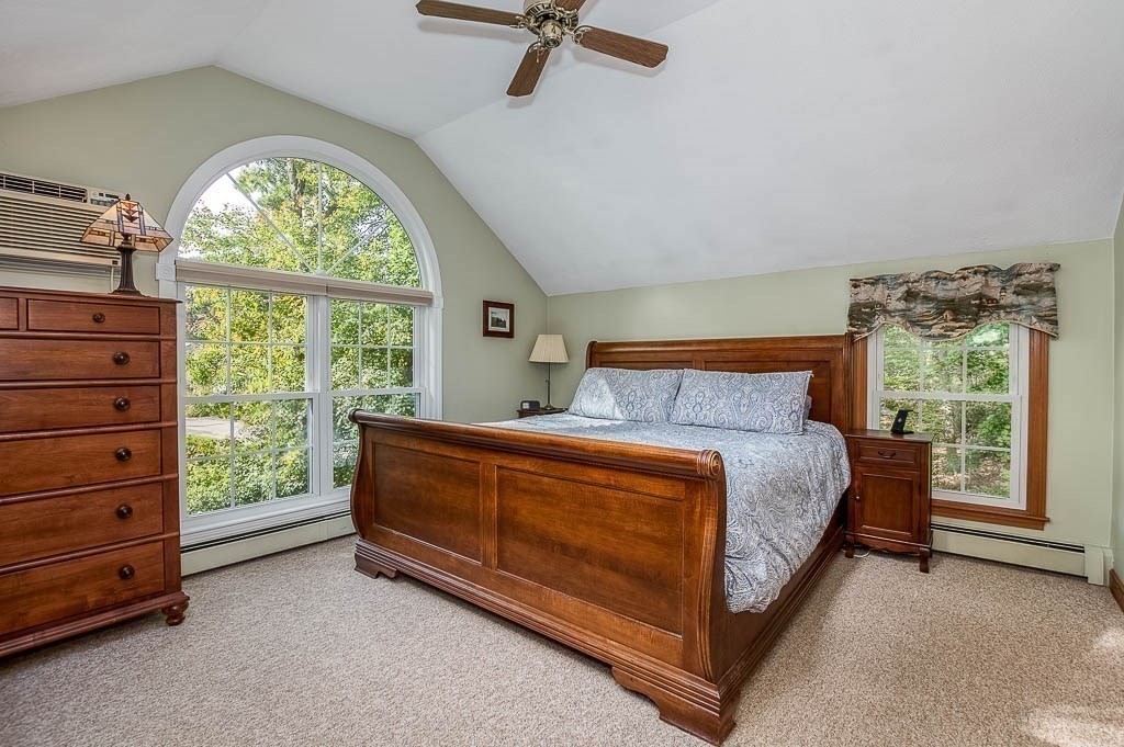 1 Intervale Road Dedham, MA 02026 - Photo 18 of 42 a bed sitting in a room next to a window