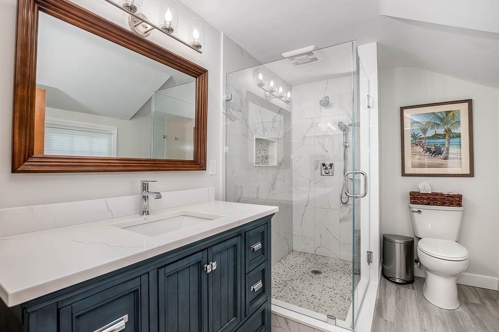 1 Intervale Road Dedham, MA 02026 - Photo 20 of 42 a bathroom with a sink a toilet and shower