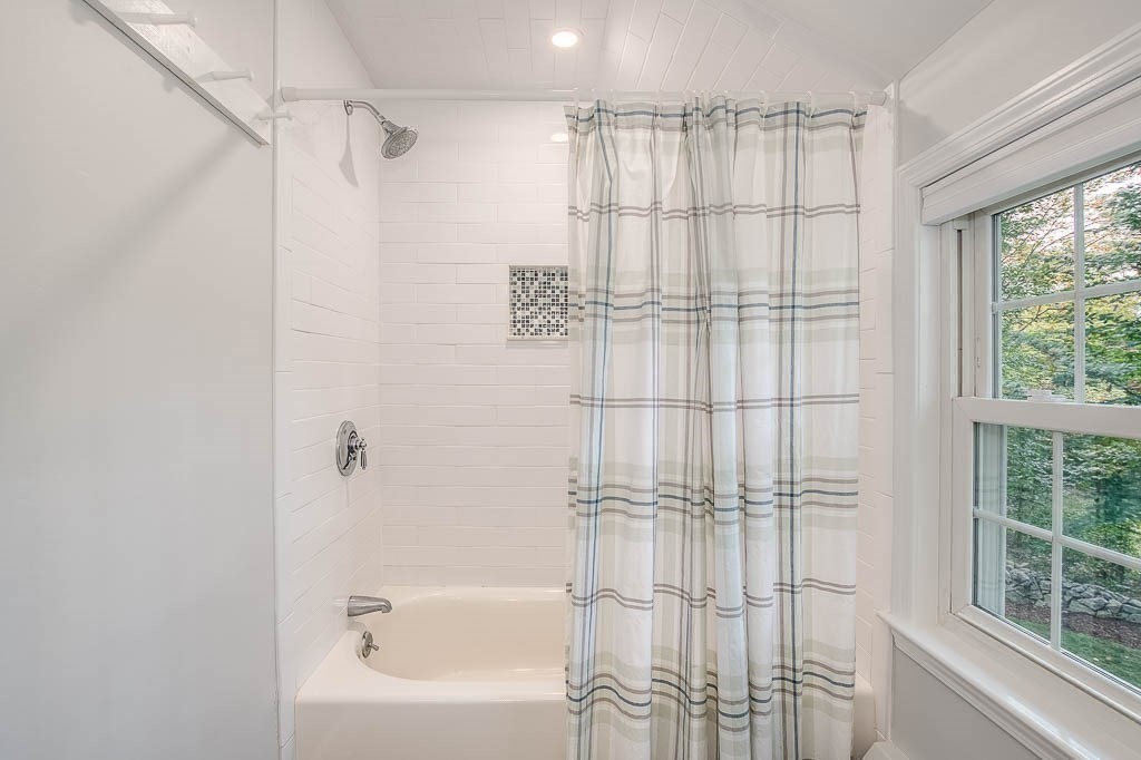 1 Intervale Road Dedham, MA 02026 - Photo 23 of 42 a bathroom with a bathtub and a shower