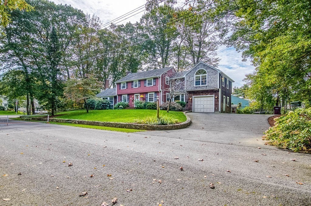 1 Intervale Road Dedham, MA 02026 - Photo 3 of 42 a view of a big house with a big yard and large trees
