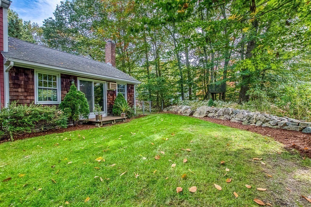 1 Intervale Road Dedham, MA 02026 - Photo 36 of 42 a view of a house with backyard sitting area and garden