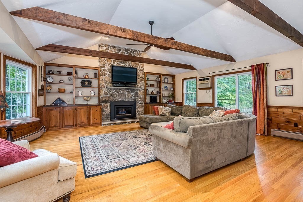 1 Intervale Road Dedham, MA 02026 - Photo 5 of 42 a living room with fireplace furniture and a flat screen tv