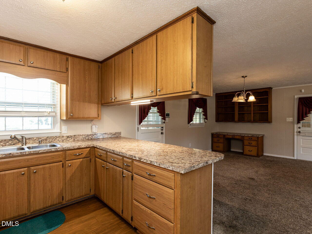2368 Swift Creek Road Clayton, NC 27520 - Photo 12 of 31 a kitchen with a sink stove and cabinets