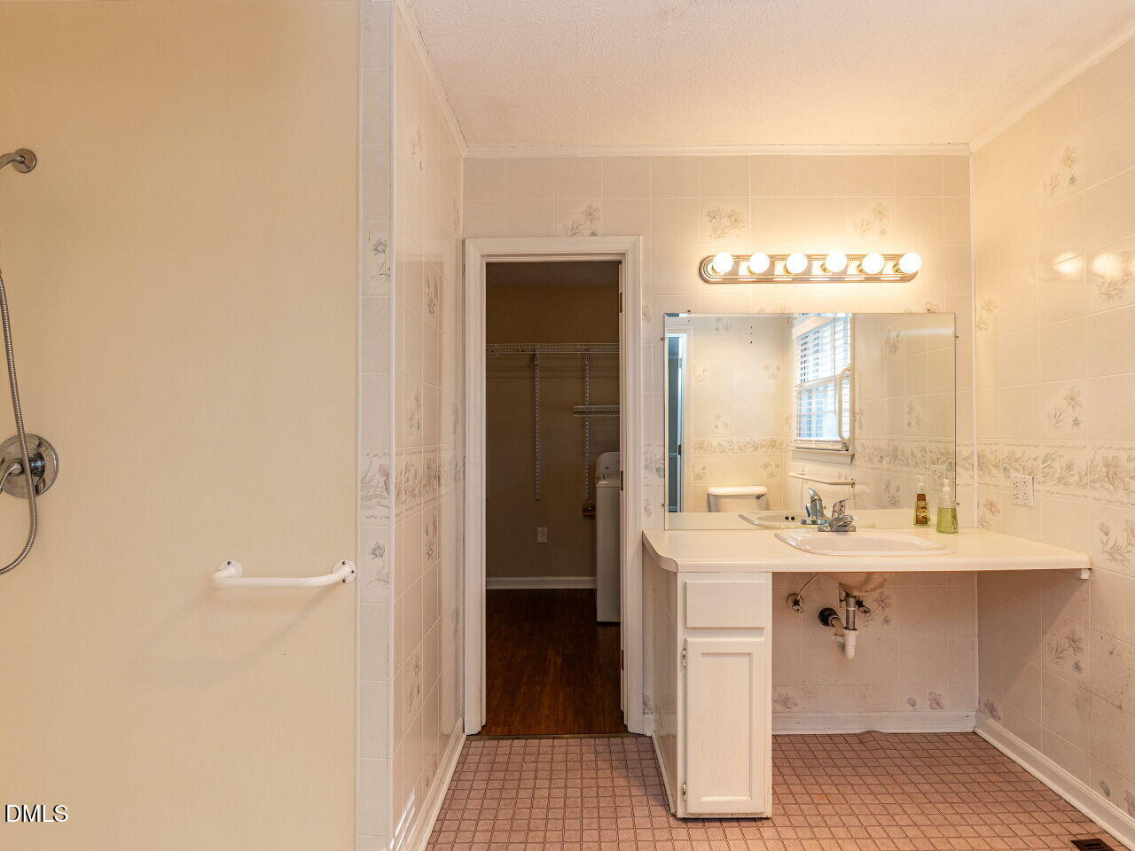 2368 Swift Creek Road Clayton, NC 27520 - Photo 21 of 31 a spacious bathroom with a sink a mirror and a shower
