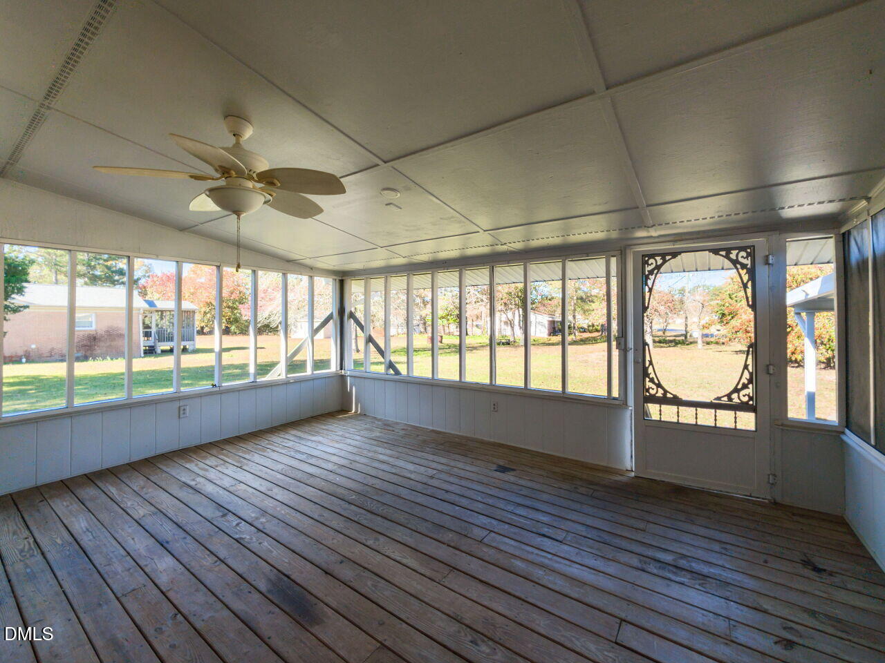 2368 Swift Creek Road Clayton, NC 27520 - Photo 28 of 31 an empty room with wooden floor and windows