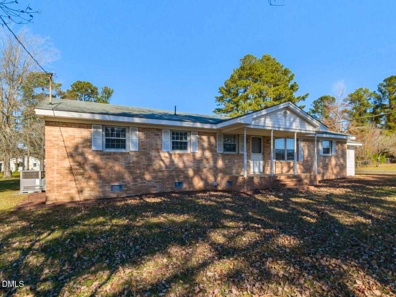2368 Swift Creek Road Clayton, NC 27520 - Photo 3 of 31 a front view of a house with a garden