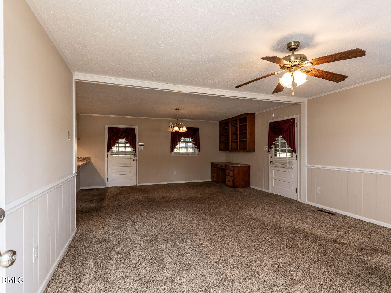 2368 Swift Creek Road Clayton, NC 27520 - Photo 4 of 31 a view of a livingroom with a ceiling fan and window