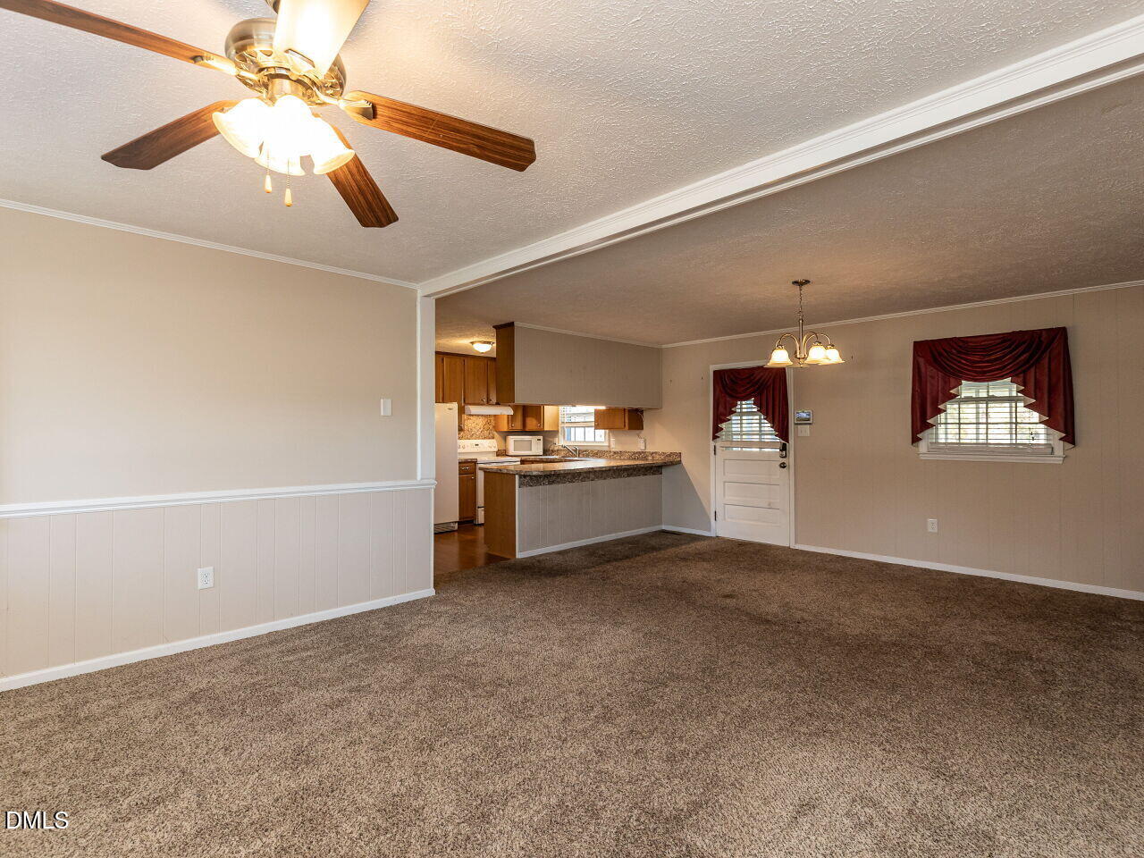 2368 Swift Creek Road Clayton, NC 27520 - Photo 5 of 31 a view of a kitchen with a sink and a ceiling fan