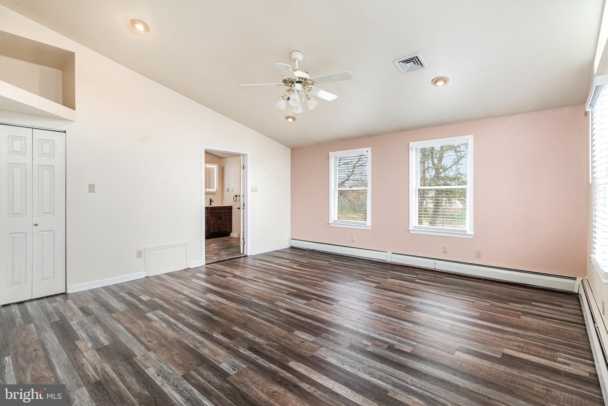 6112 Linglestown Road Harrisburg, PA 17112 - Photo 16 of 45 a view of an empty room with wooden floor and a window