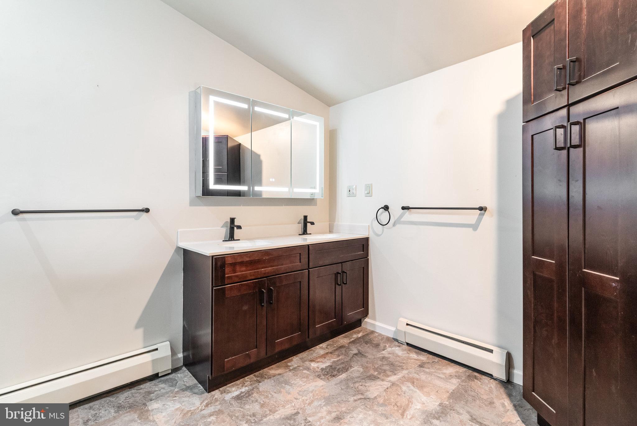 6112 Linglestown Road Harrisburg, PA 17112 - Photo 18 of 45 a spacious bathroom with a double vanity sink and mirror