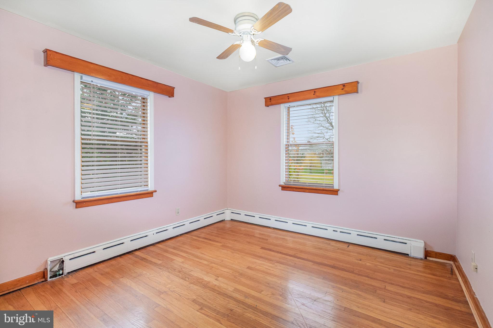 6112 Linglestown Road Harrisburg, PA 17112 - Photo 22 of 45 a view of an empty room with wooden floor and a window