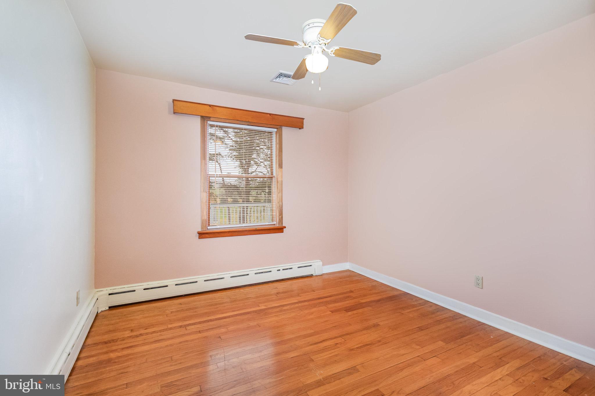 6112 Linglestown Road Harrisburg, PA 17112 - Photo 24 of 45 an empty room with a window and a ceiling fan