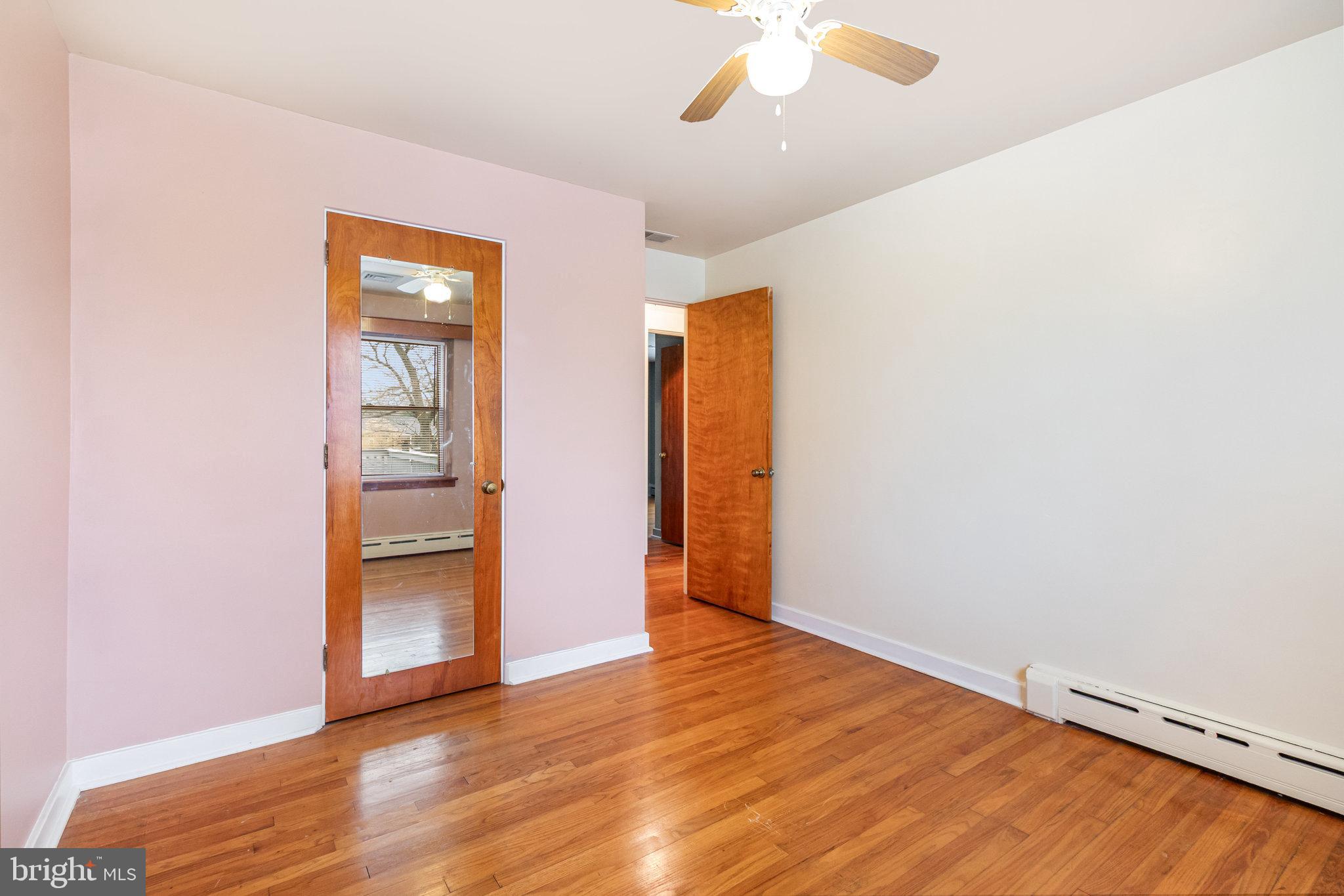 6112 Linglestown Road Harrisburg, PA 17112 - Photo 25 of 45 an empty room with wooden floor closet and windows