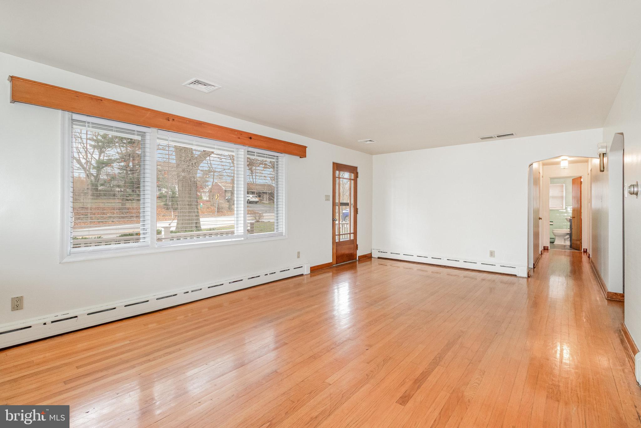 6112 Linglestown Road Harrisburg, PA 17112 - Photo 6 of 45 a view of empty room with wooden floor and fan