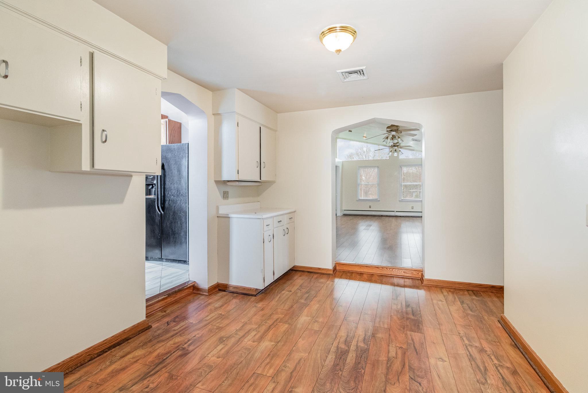 6112 Linglestown Road Harrisburg, PA 17112 - Photo 9 of 45 a view of a kitchen with a refrigerator cabinets and wooden floor
