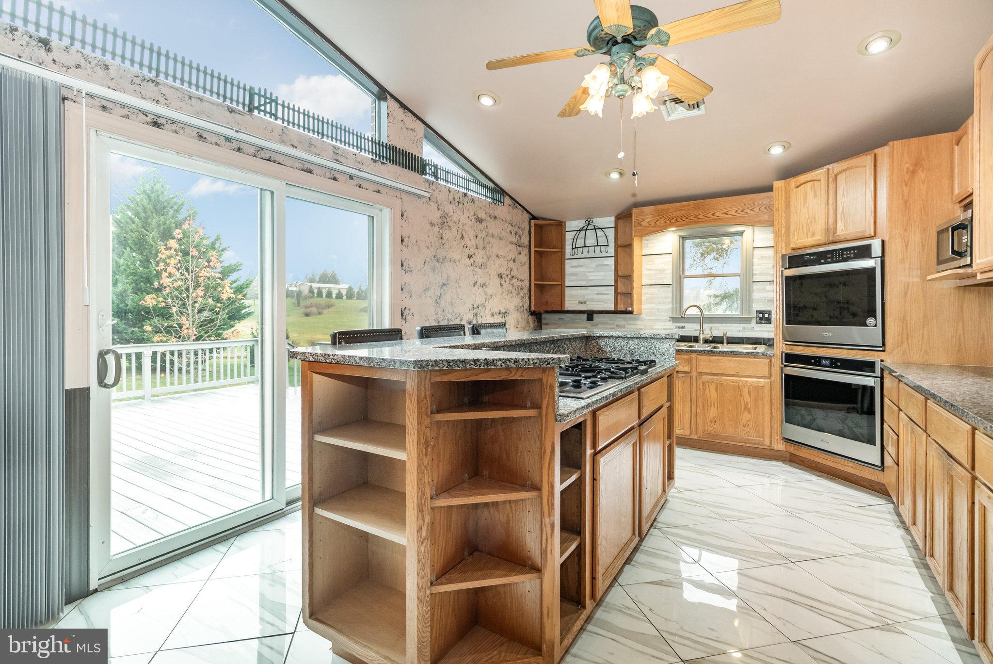 6112 Linglestown Road Harrisburg, PA 17112 - Photo 10 of 45 a kitchen with stainless steel appliances granite countertop a stove and a sink