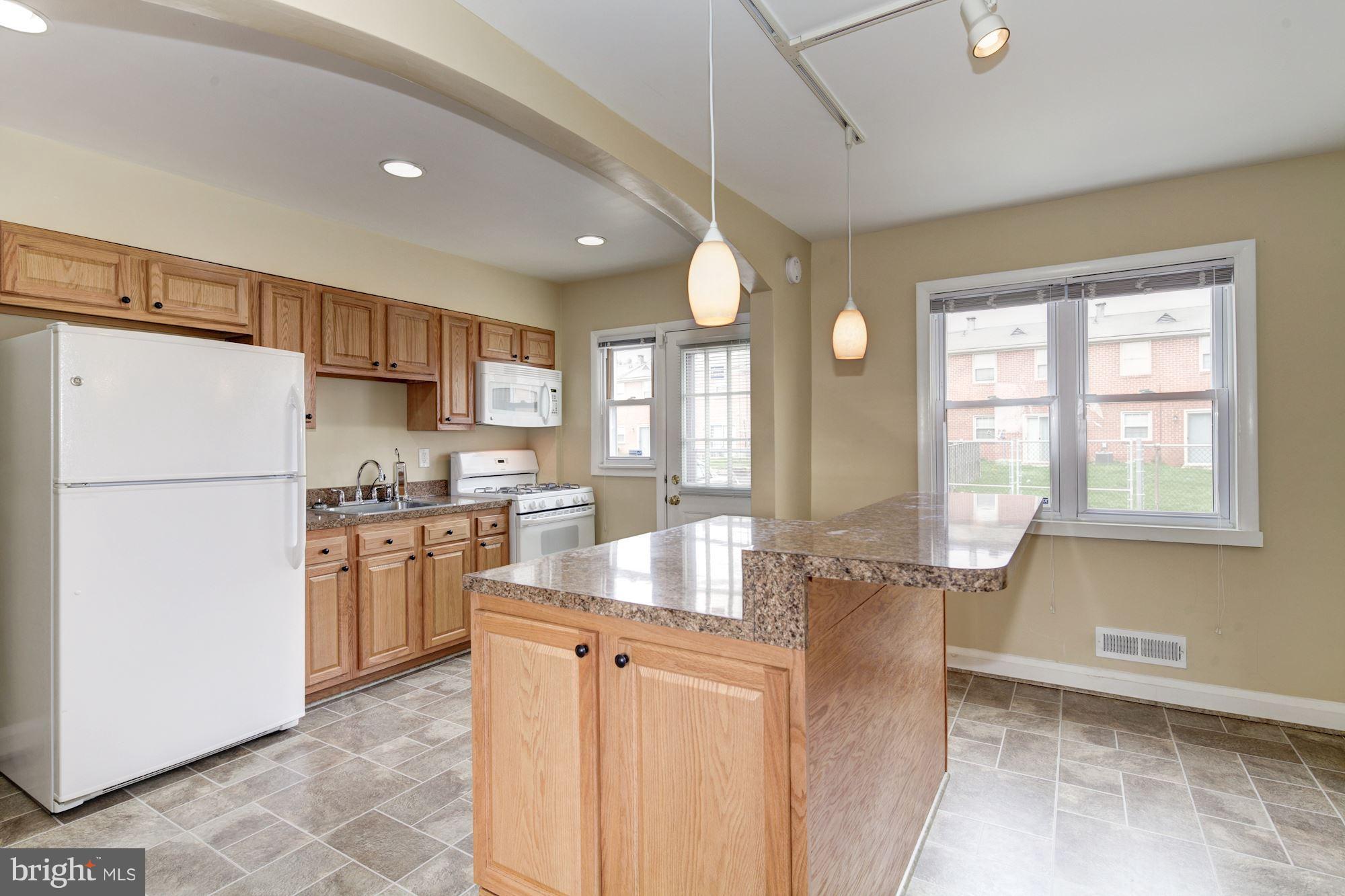 514 Queensgate Road Baltimore, MD 21229 - Photo 5 of 29 Kitchen, door to back entrance.