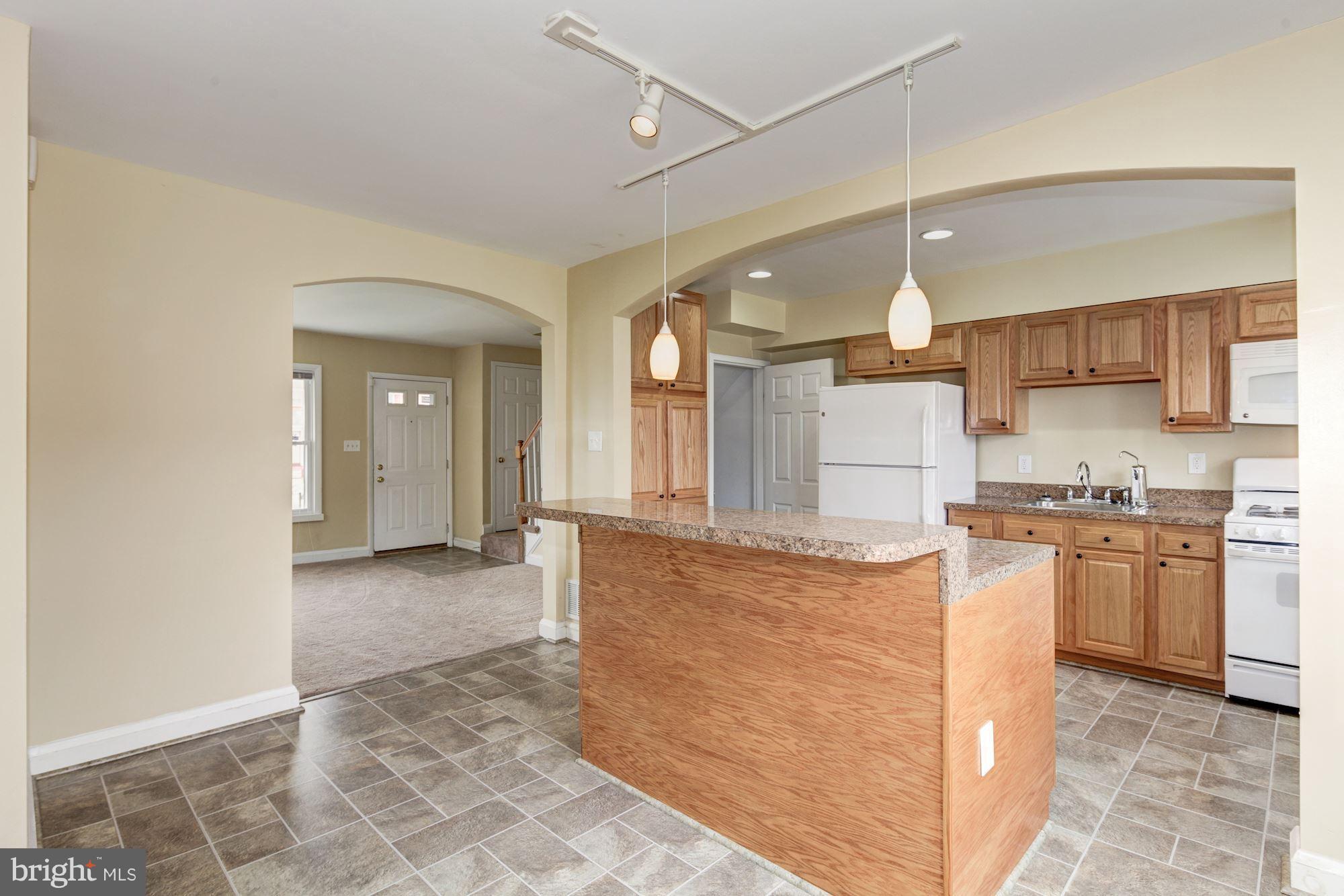 514 Queensgate Road Baltimore, MD 21229 - Photo 8 of 29 Kit to Liv Rm & Staircase to Basement