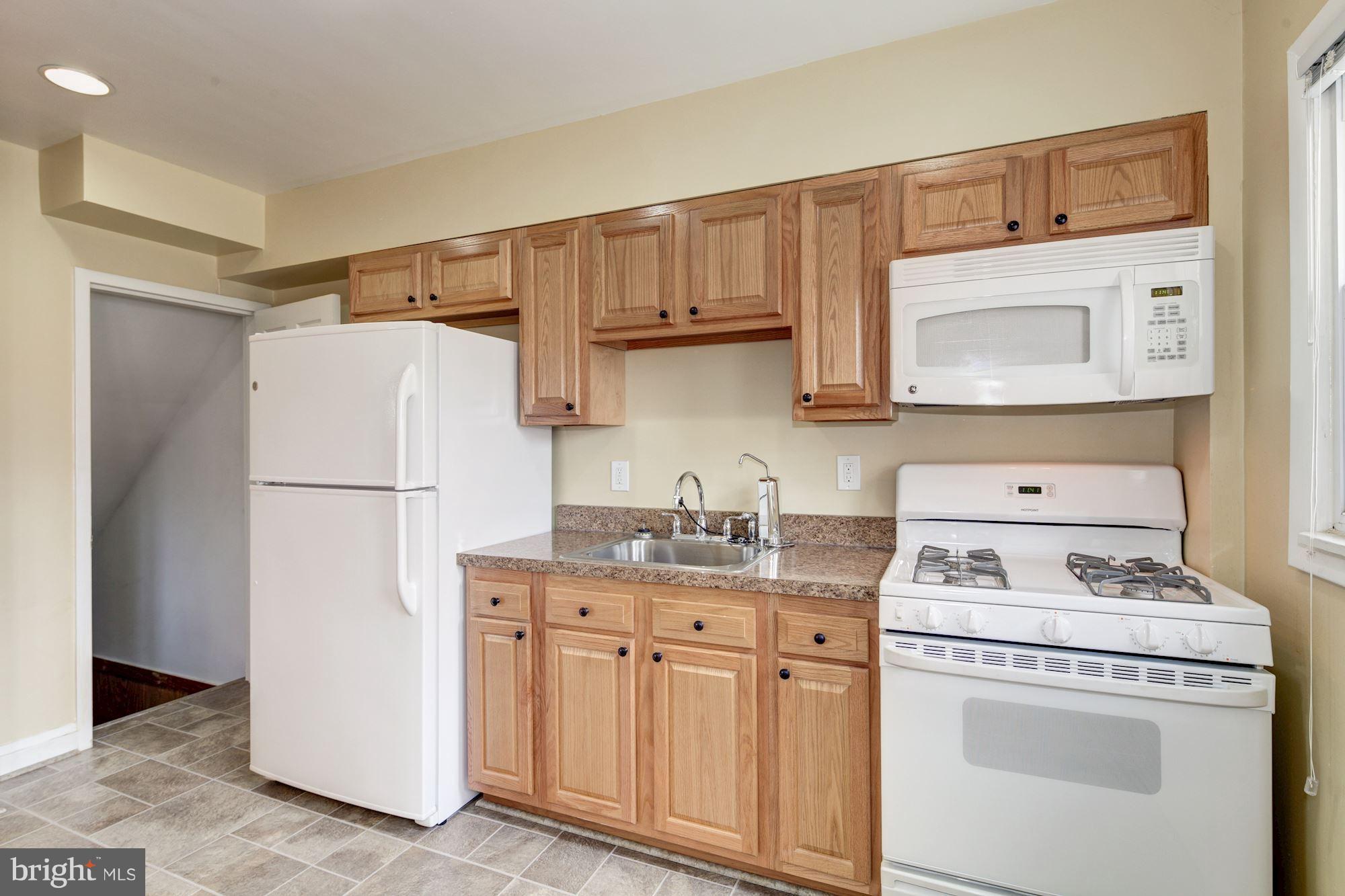 514 Queensgate Road Baltimore, MD 21229 - Photo 9 of 29 Kitchen & Staircase to Basement
