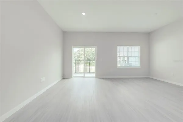 a view of a kitchen with a sink and cabinets