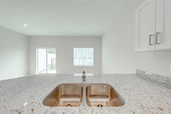a kitchen with granite countertop a sink and a granite counter tops