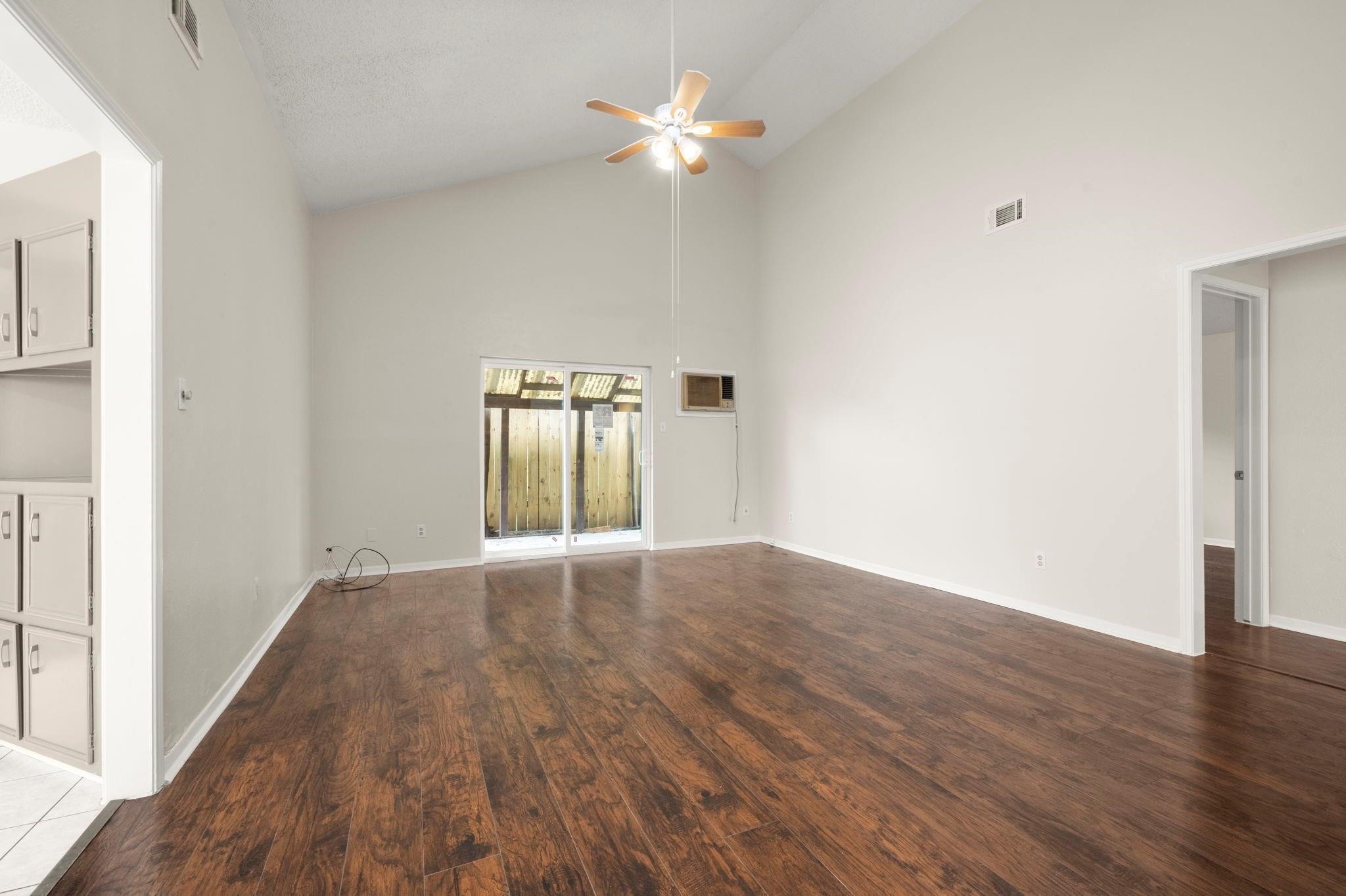 11718 Ridge Run Drive Houston, TX 77064 - Photo 12 of 17 a view of an empty room with wooden floor