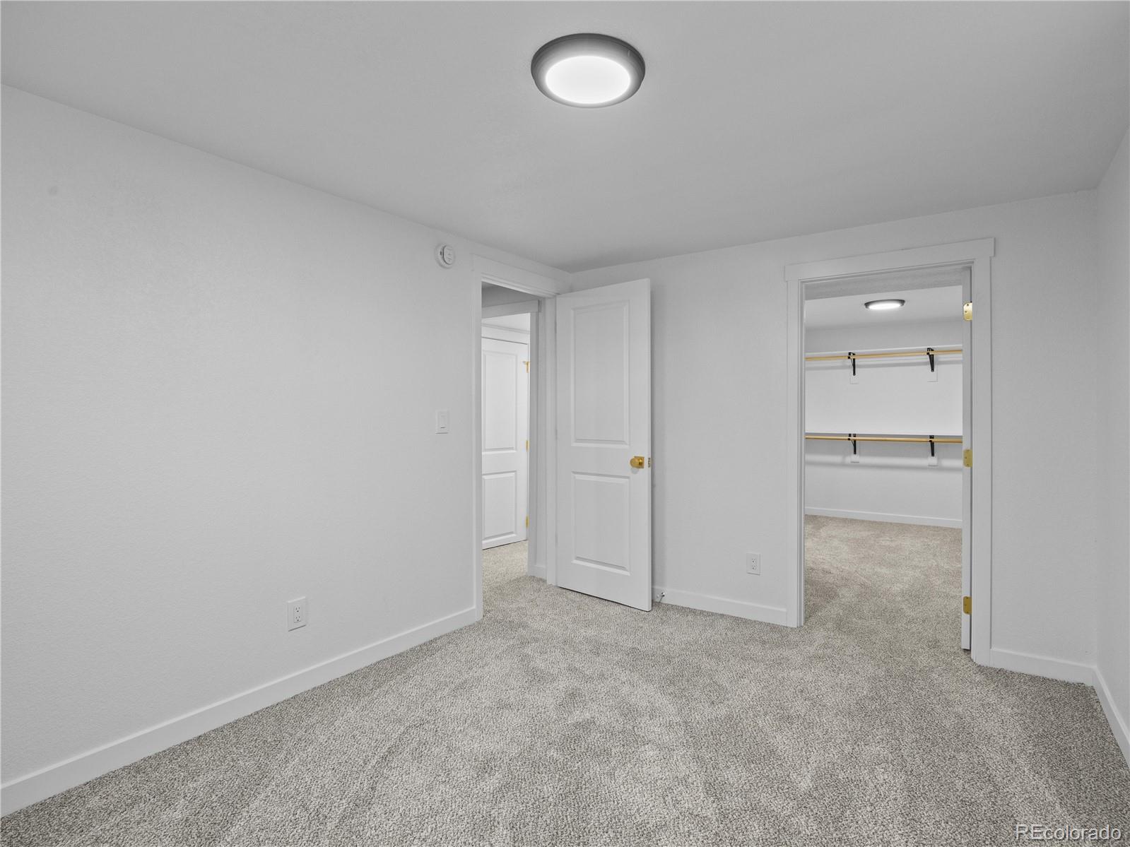 5673 Johnson Street Arvada, CO 80002 - Photo 30 of 40 a view of an empty room and window