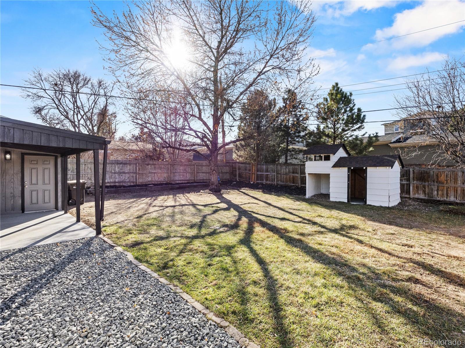 5673 Johnson Street Arvada, CO 80002 - Photo 36 of 40 a view of a house with snow on the ground