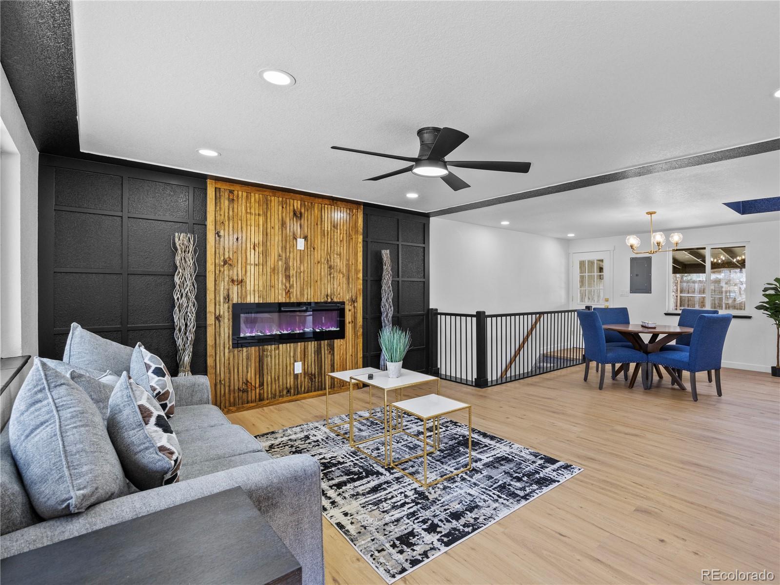 5673 Johnson Street Arvada, CO 80002 - Photo 7 of 40 a living room with furniture and a large window