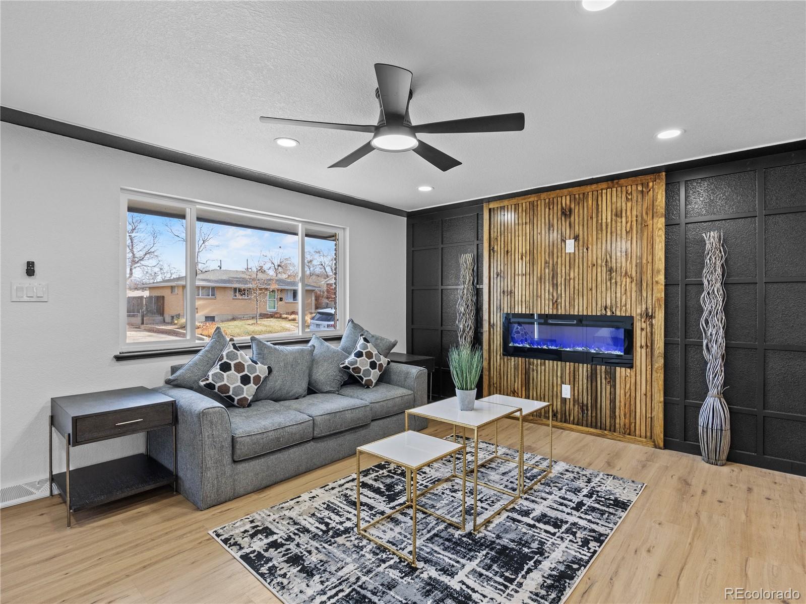 5673 Johnson Street Arvada, CO 80002 - Photo 9 of 40 a living room with furniture and a rug