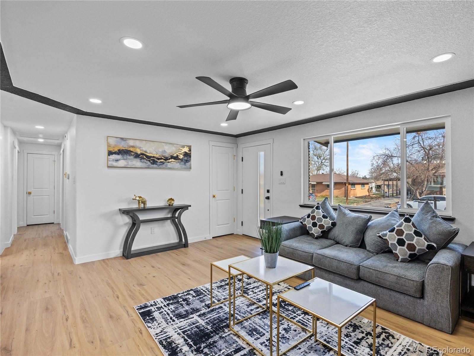 5673 Johnson Street Arvada, CO 80002 - Photo 10 of 40 a living room with furniture and a large window