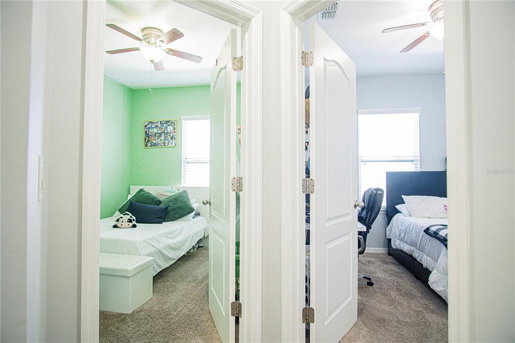 11636 Water Run Alley Windermere, FL 34786 - Photo 11 of 18 a bedroom with a bed and ceiling fan