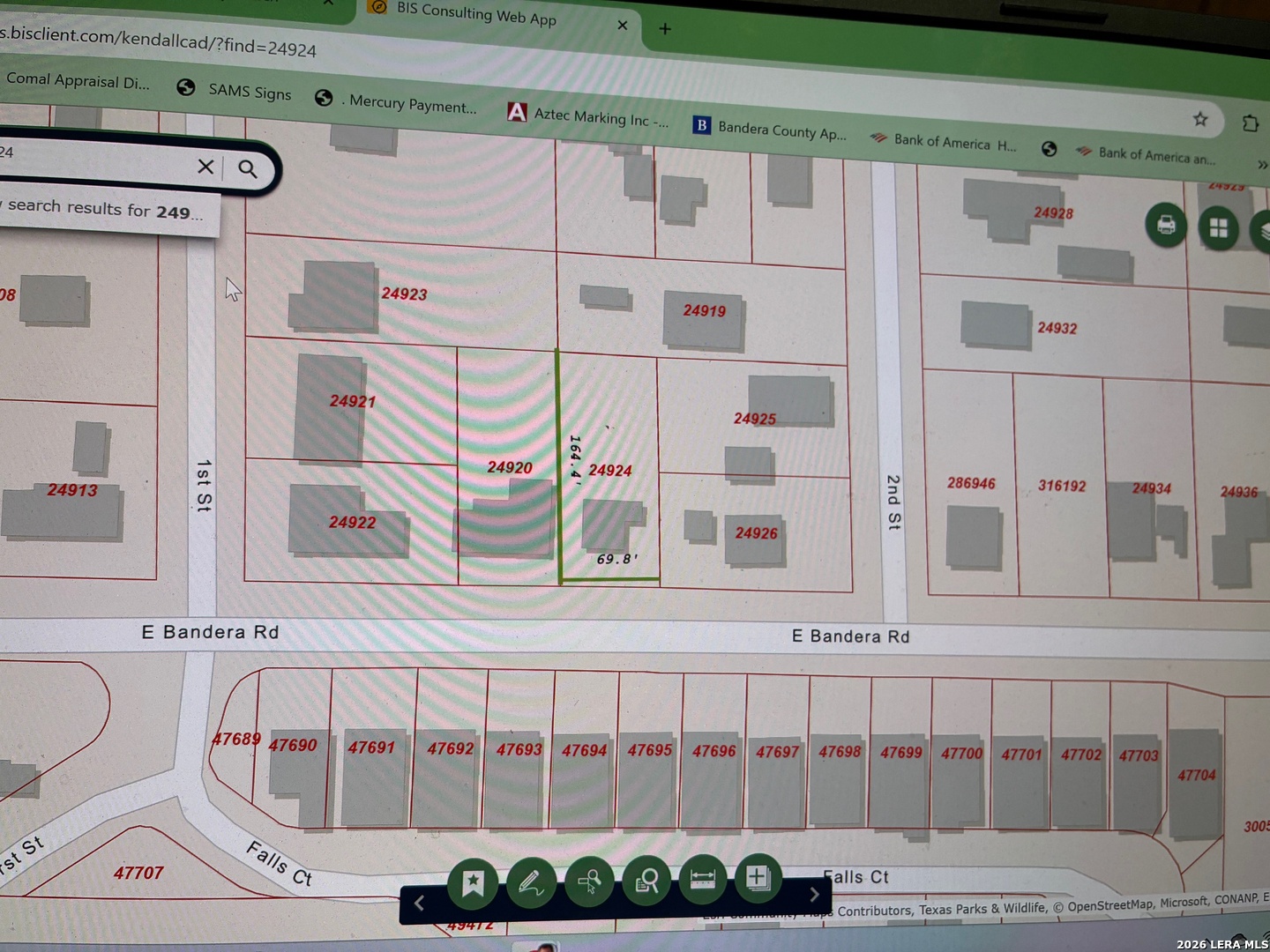 314 East Bandera Road Boerne, TX 78006 - Photo 1 of 8 a bathroom with a sink a mirror and a shower