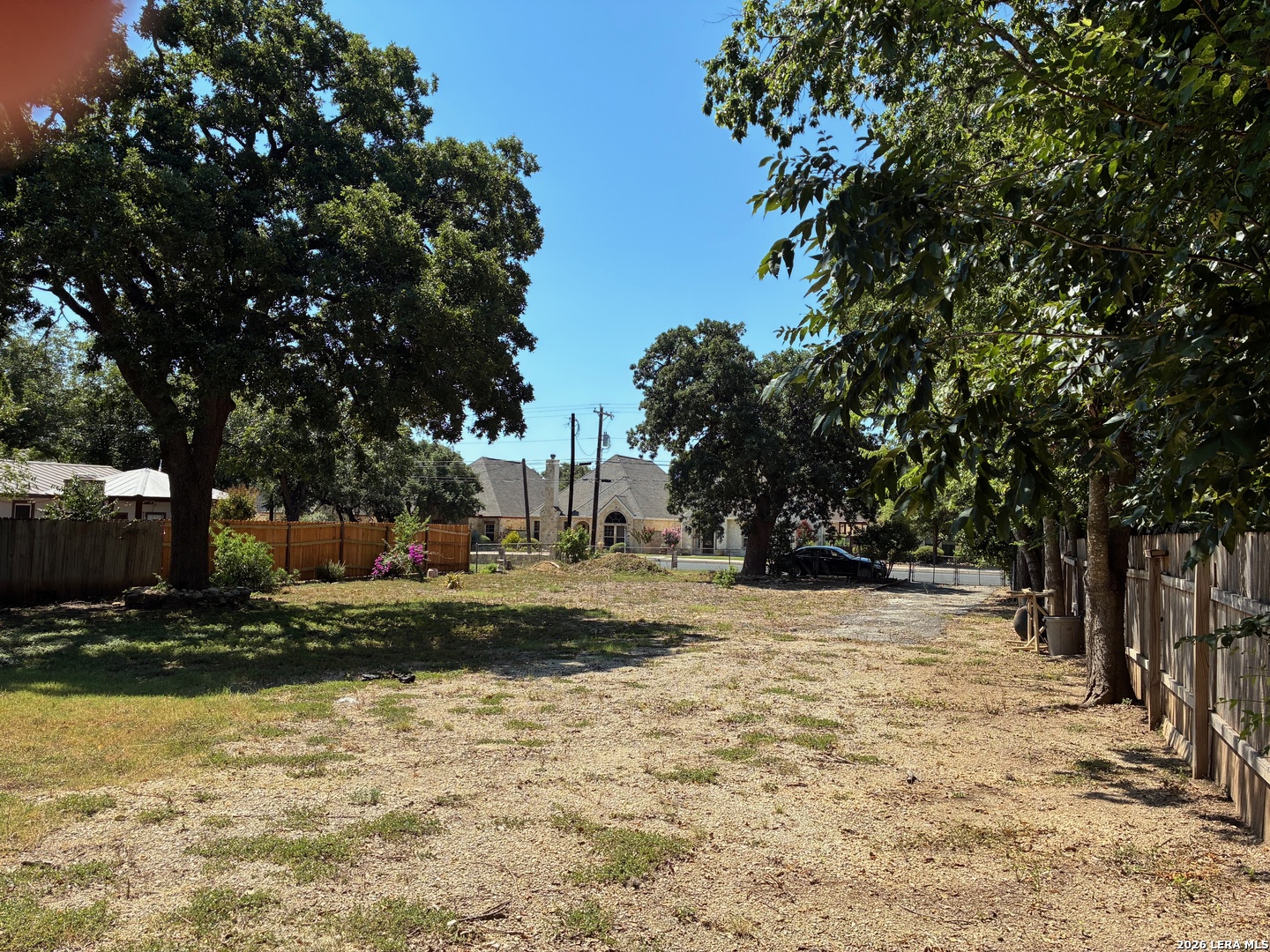 314 East Bandera Road Boerne, TX 78006 - Photo 3 of 8 a view of a yard with wooden fence