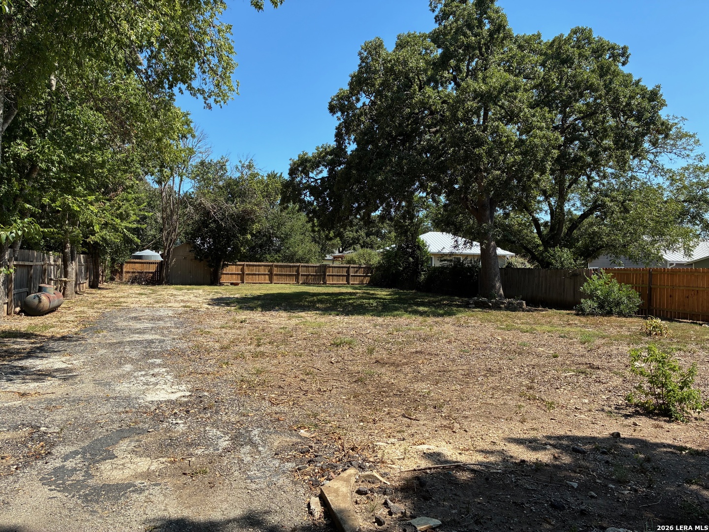 314 East Bandera Road Boerne, TX 78006 - Photo 6 of 8 a backyard of a house with large trees
