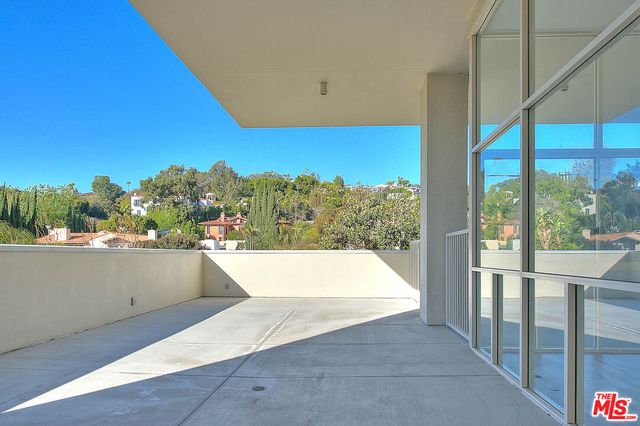 a view of balcony and kitchen
