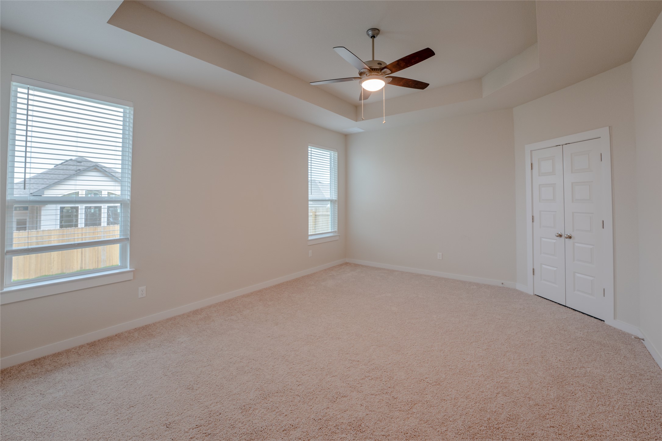 133 High Plains Drive Georgetown, TX 78628 - Photo 16 of 38 an empty room with windows and fan
