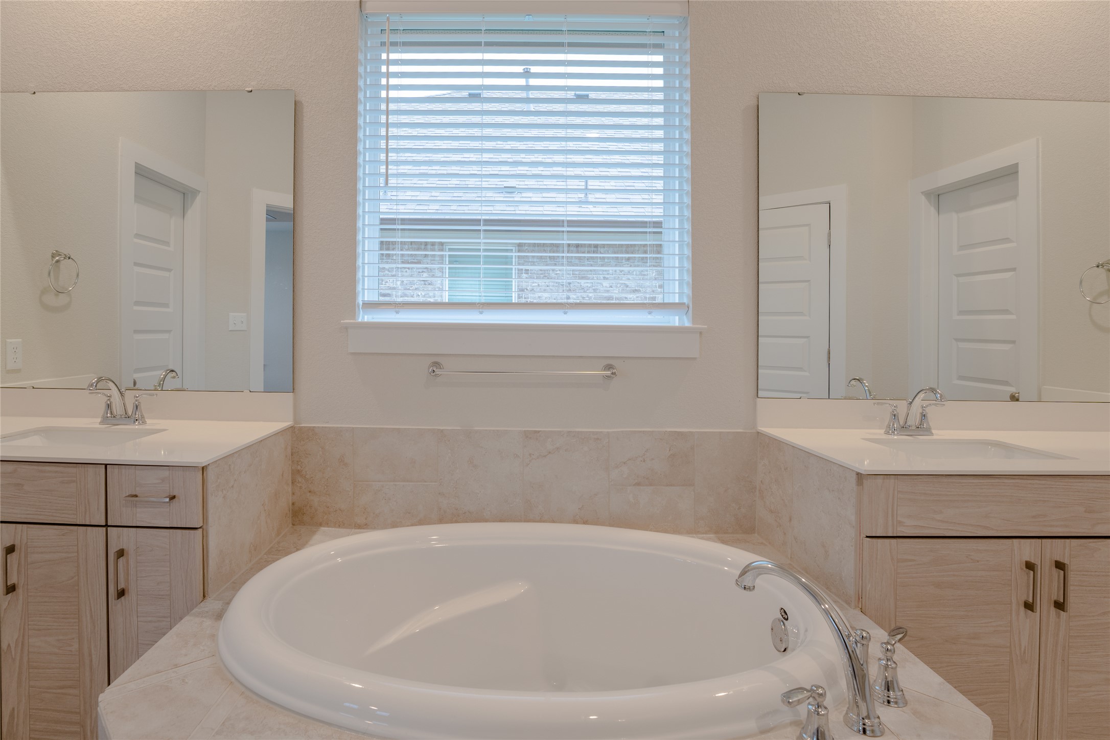 133 High Plains Drive Georgetown, TX 78628 - Photo 19 of 38 a white bath tub sitting in a bathroom and sink