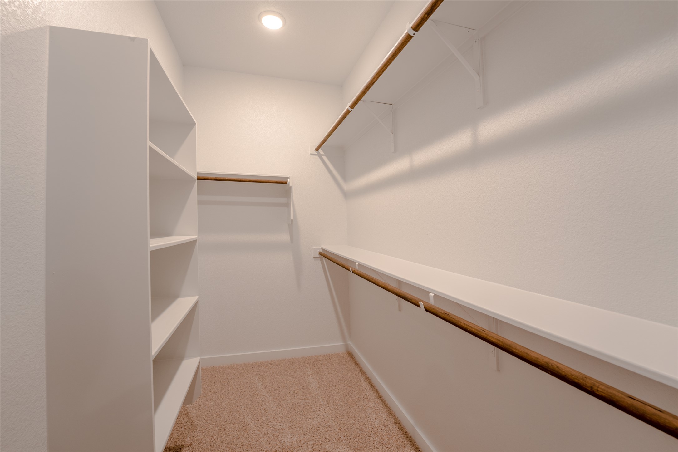 133 High Plains Drive Georgetown, TX 78628 - Photo 21 of 38 a view of an empty walk in closet