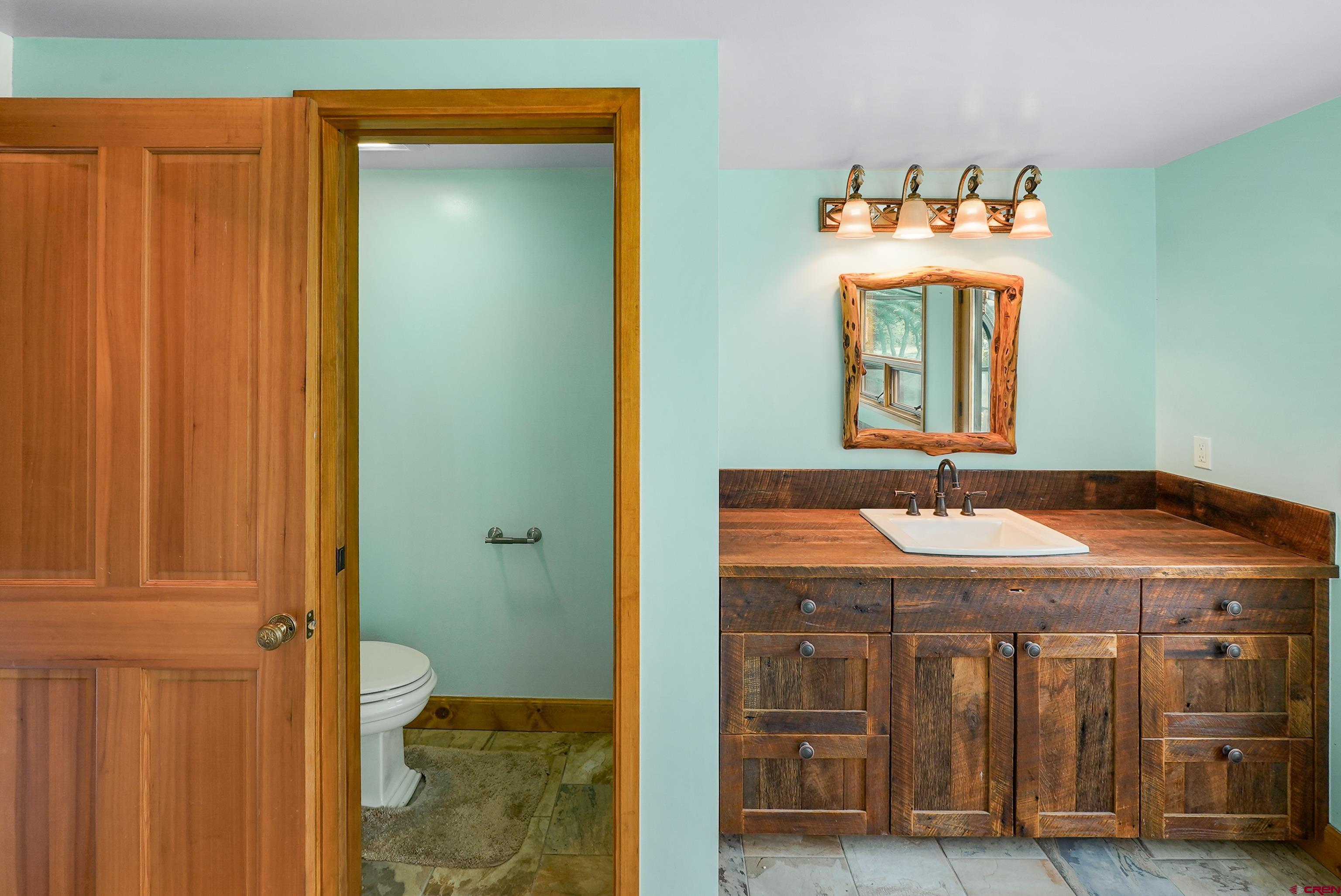 4462 County Road 124 Durango, CO 81301 - Photo 28 of 44 a bathroom with a sink and a mirror