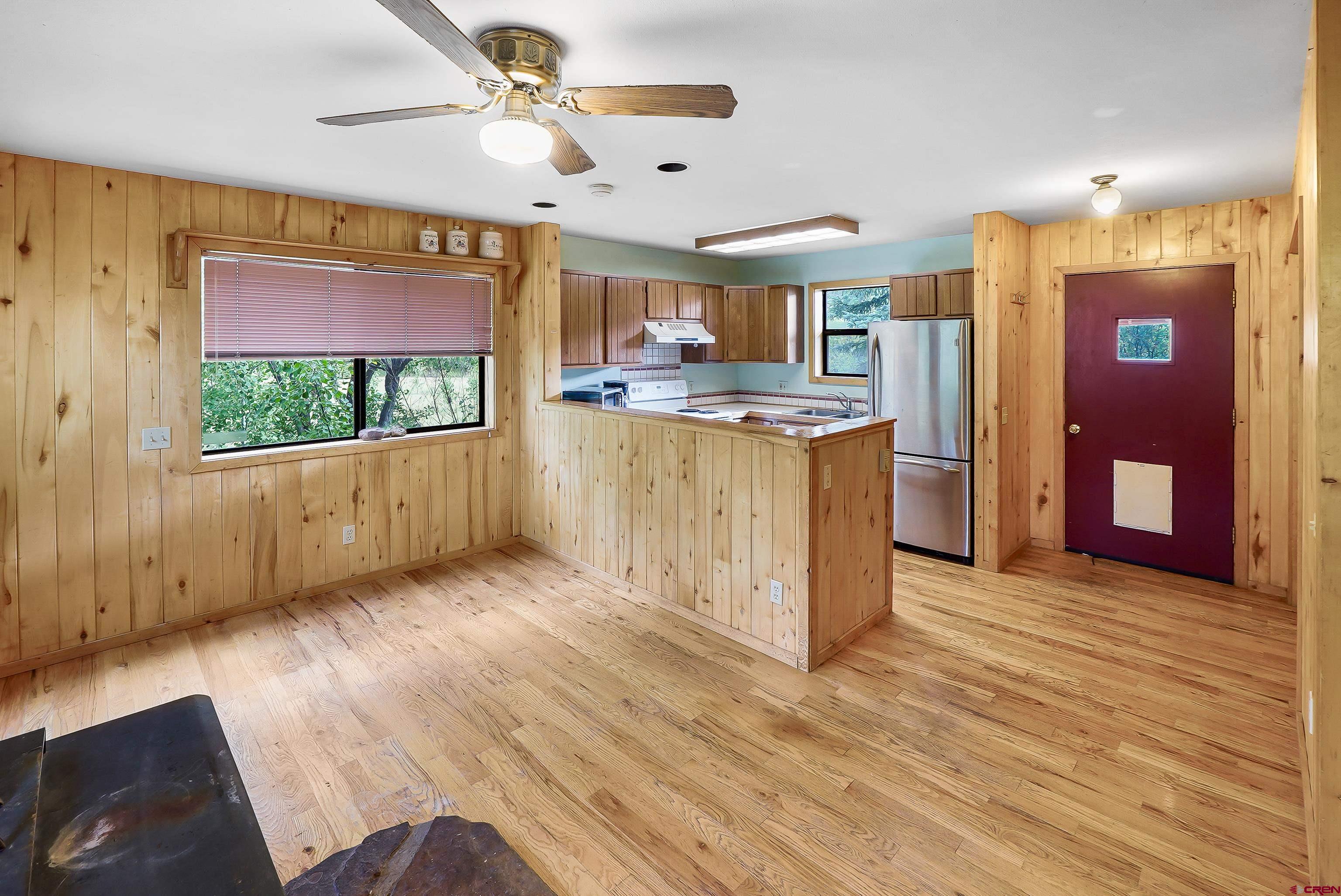 4462 County Road 124 Durango, CO 81301 - Photo 41 of 44 a view of a kitchen with a sink hardwood floor and a large window